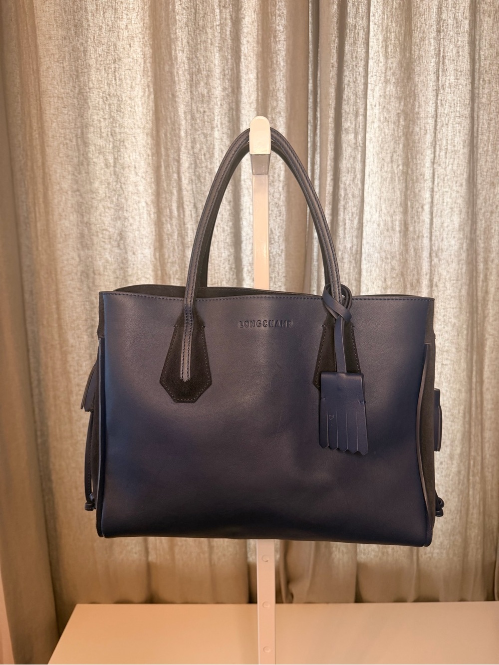 Longchamp Navy LeatherTote with Tassel Charm and suede side panels w/ duster